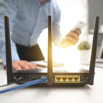 Router with network cables in a professional office setting.
